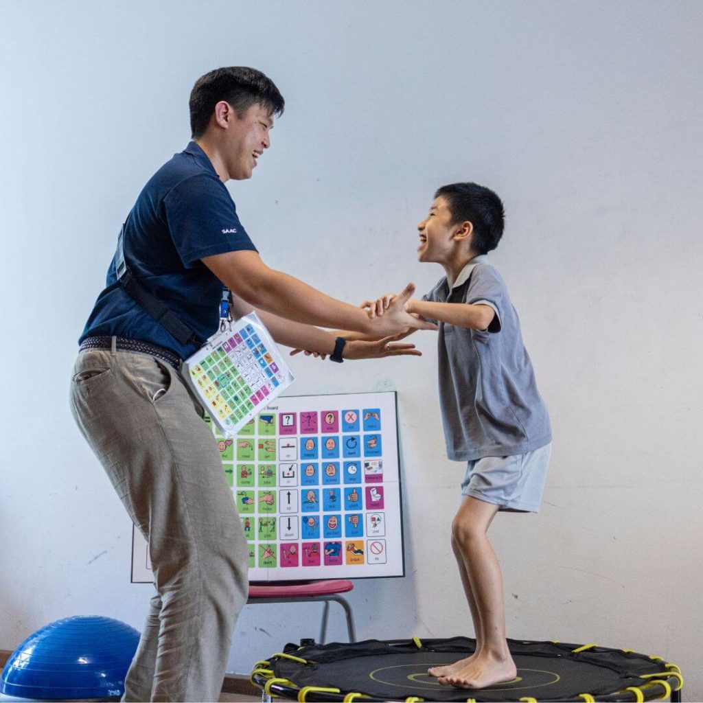 SAAS teacher sharing light-hearted moment with his student.